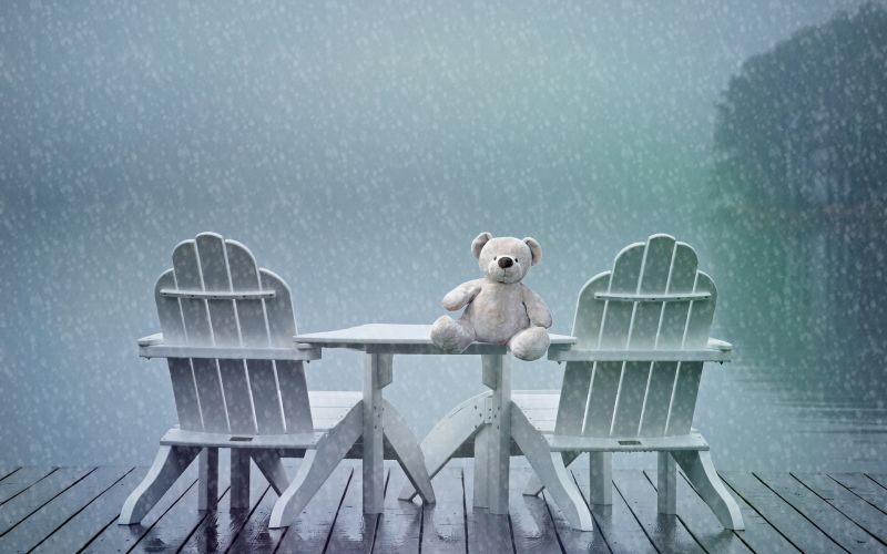 lonely teddy feeling blue in rain