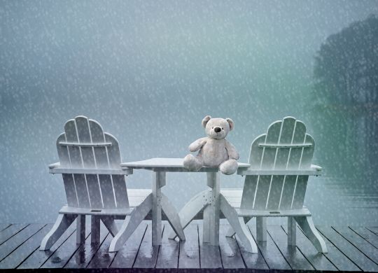 lonely teddy feeling blue in rain