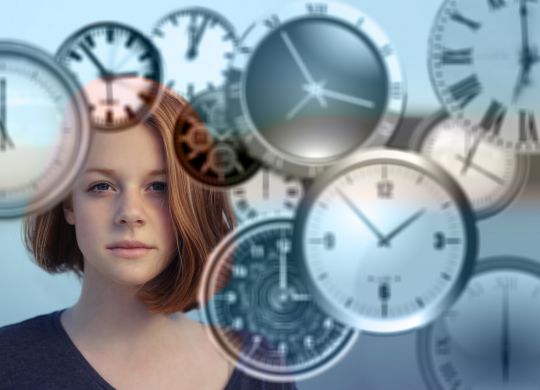 woman with clocks managing time