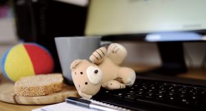 computer and toys to show working mum