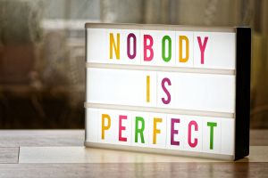 SIgn saying Nobody Is Perfect